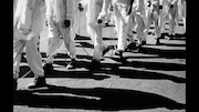 Prisoners on a chain gang at Limestone Correctional Facility make their way to a work detail, 1995. Location: Harvest, Alabama, United States.