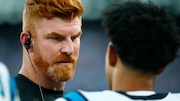 Carolina Panthers veteran quarterback Andy Dalton, left, speaks to rookie QB Bryce Young during an NFL preseason football game against the New York Giants Friday, Aug. 18, 2023, in East Rutherford, N.J. (AP Photo/John Munson)