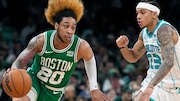 Boston Celtics' JD Davison (20) drives past Charlotte Hornets' Tre Mann (23) during the second half of an NBA basketball game, Friday, April 12, 2024, in Boston. (AP Photo/Michael Dwyer)