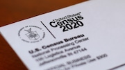 An envelope containing a 2020 census letter mailed to a U.S. resident is seen, April 5, 2020, in Detroit.