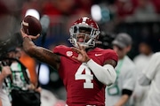 Alabama quarterback Jalen Milroe (4) runs drills before the Southeastern Conference championship NCAA college football game against Georgia in Atlanta, Saturday, Dec. 2, 2023. (AP Photo/Mike Stewart)