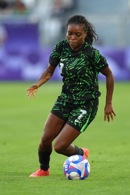 Midfielder Toni Payne of Nigeria dribbles the ball during a match against Brazil during the Summer Olympics