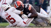 Cleveland Browns defensive tackle Dalvin Tomlinson sacks Arizona Cardinals quarterback Clayton Tune during an NFL game on Nov. 5, 2023, at Cleveland Browns Stadium in Cleveland.