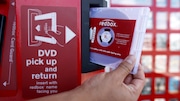 FILE - A rental DVD is dispensed from a Redbox at a 7-Eleven in Los Angeles on August 7, 2009. Chicken Soup for the Soul Entertainment, the owner of DVD rental operator Redbox, filed for Chapter 11 bankruptcy protection, Friday, June 28, 2024. (AP Photo/Damian Dovarganes, File)