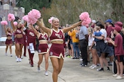 Florida State dancers and cheerleaders walk in front of the team on their way to the stadium before an NCAA college football game against Syracuse, Saturday, Oct. 14, 2023, in Tallahassee, Fla. (AP Photo/Phelan M. Ebenhack)