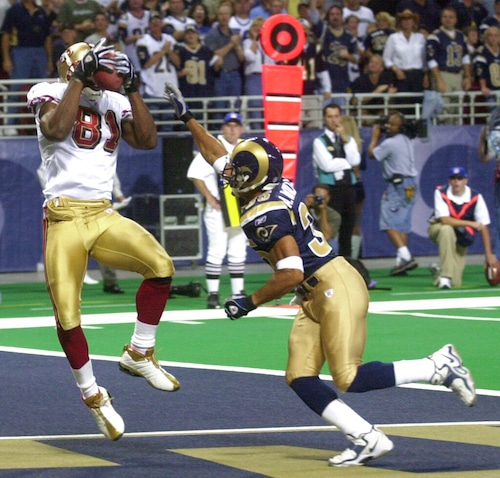 San Francisco 49ers wide receiver Terrell Owens catches a touchdown pass during an NFL game against the St. Louis Rams