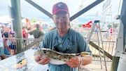 Sean Powers, director of the University of South Alabama’s Stokes School of Marine and Environmental Sciences and a judge at the Alabama Deep Sea Fishing Rodeo, holds up a blunt head puffer that won the "Most Unusual" category at the 91st ADSFR.