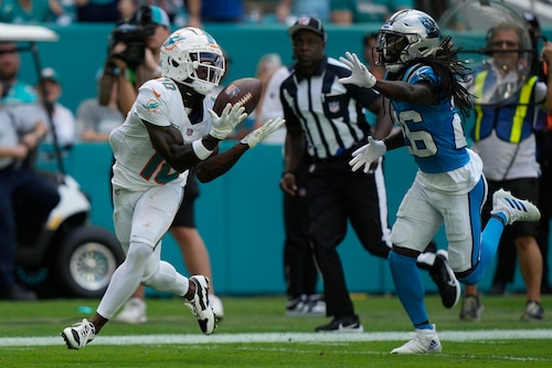 Miami Dolphins wide receiver Tyreek Hill catches the football during an NFL game against the Carolina Panthers