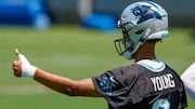 Carolina Panthers quarterback Bryce Young gives a thumbs up at the NFL football team's practice in Charlotte, N.C., Tuesday, June 11, 2024. (AP Photo/Nell Redmond)