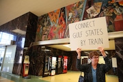 A woman joined others in Union Passenger Terminal in New Orleans, La., on Thursday, Feb. 18, 2016, to show support for revitalizing passenger rail service east of New Orleans into Mississippi, Alabama and Florida. (file photo)