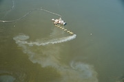 Aerial image of dredged sediment being deposited in Mobile Bay. Dredging and depositing the spoil back into the bay harms Gulf Sturgeon, a giant fish that spends their winters in the bay, Mobile Baykeeper argues. The environmental group, along with the Center for Biological Diversity, notified the U.S. Army Corps of Engineers Tuesday of their intent to sue over the Corps' alleged failure to protect the sturgeon. (Photo by Sam St. John, courtesy Mobile Baykeeper)