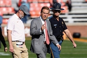 Alabama head coach Nick Saban walks the field before an NCAA college football game against Auburn Saturday, Nov. 25, 2023, in Auburn, Ala. (AP Photo/Butch Dill)