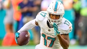 Miami Dolphins wide receiver Jaylen Waddle (17) runs with the ball past New York Jets linebacker Quincy Williams (56) during an NFL football game, Sunday, Dec 17, 2023, in Miami Gardens, Fla. (AP Photo/Doug Murray)