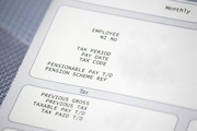 Paycheck stock photo. Downloaded from Advance Getty Images account in August 2023.