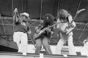 American southern rock group, Lynyrd Skynyrd, performing at John F. Kennedy Stadium, Philadelphia, USA, 11th June 1977. Left to right: Ronnie Van Zant (1948 - 1977), Gary Rossington and Allen Collins (1952 - 1990). (Photo by Michael Putland/Getty Images)