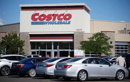 Costco storefront in Colorado with cars parked out front